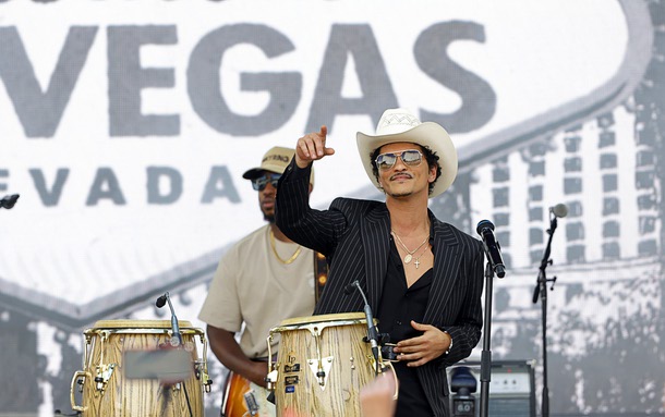 Entertainer Bruno Mars performs for fans in Toshiba Plaza after a parade down the Las Vegas Strip Friday, April 10, 2026, in Las Vegas. The governor proclaimed April 10, 2026 as “Bruno Mars Day” and Clark County renamed a street to Bruno Mars Drive in his honor.