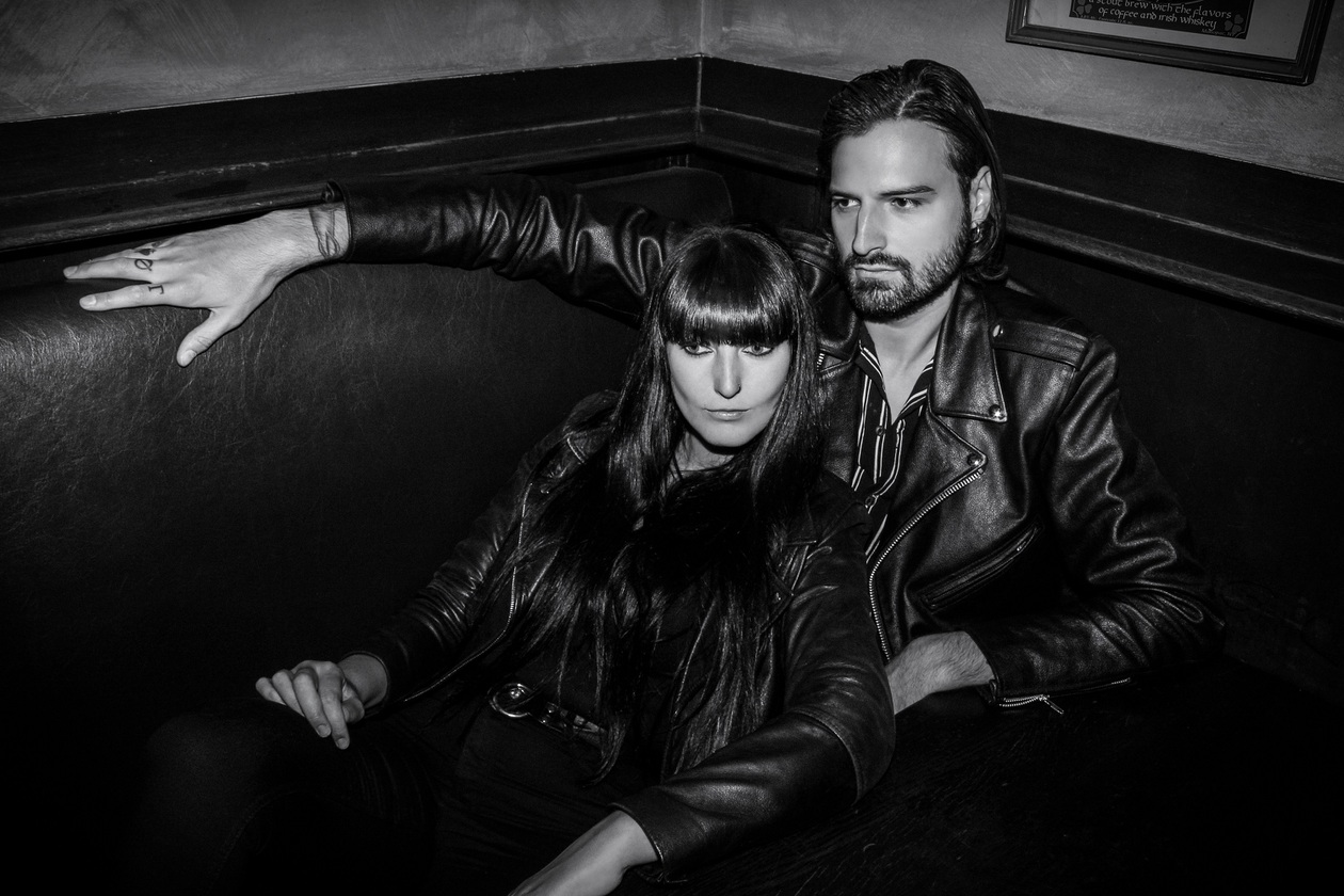 Grounded in Belgium’s electro lineage, the band balances reverence with reinvention. Its sound pairs Gaelle Souflet’s hypnotic synth lines with Sam Hugé’s commanding baritone.