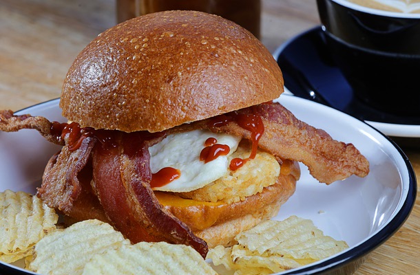 The Bodega Sando, a breakfast sandwich, is shown at Vesta Coffee Roasters, 1114 S. Casino Center Blvd., in the Arts District Friday, June 12, 2026. The sandwich originally started as a secret menu item. Bodega Sando - center-cut bacon, over medium egg hash browns, cheddar cheese and habanero ketchup on an in-house made brioche bunVanilla Cardamom LatteMont Blanc - cold brew with vanilla foam, fresh orange zest and grated nutmeg