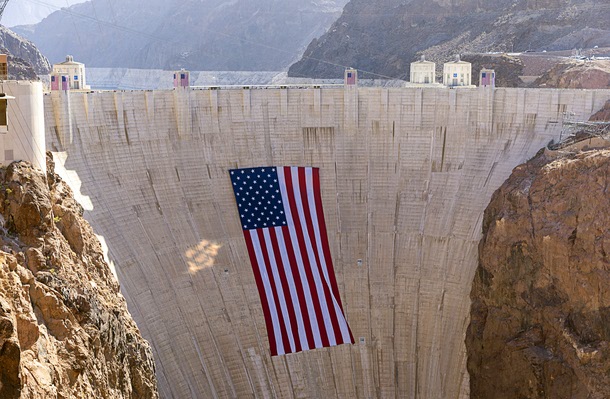 A 300-foot-wide by 150-foot-tall American flag is displayed on Hoover Dam Tuesday, June 30, 2026.