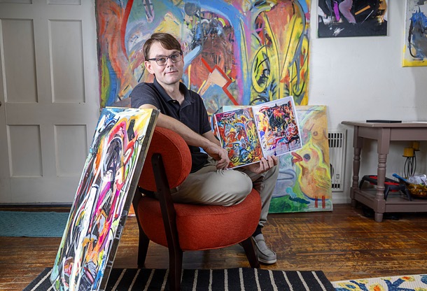 Artist Brian Gibson poses with artwork in his home in Las Vegas Wednesday, July 29, 2026.